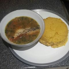 A picture of Pounded plantain(Onunu) with Tilapia pepper soup.