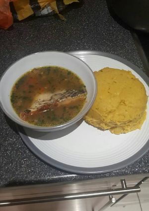 A picture of Pounded plantain(Onunu) with Tilapia pepper soup.
