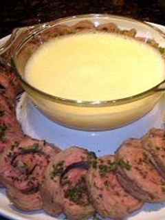 A picture of Poached Beef Topside Steak Pinwheels with Sabayon Sauce.