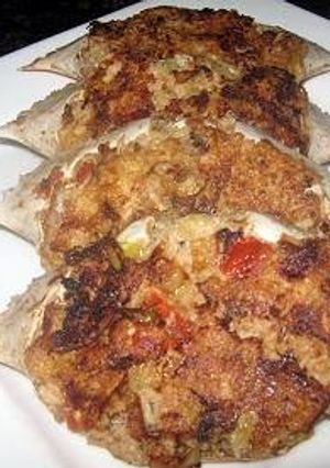 A picture of Crab Omellete Stuffed in Shell.