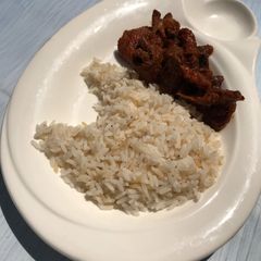 A picture of Rice with sauce.