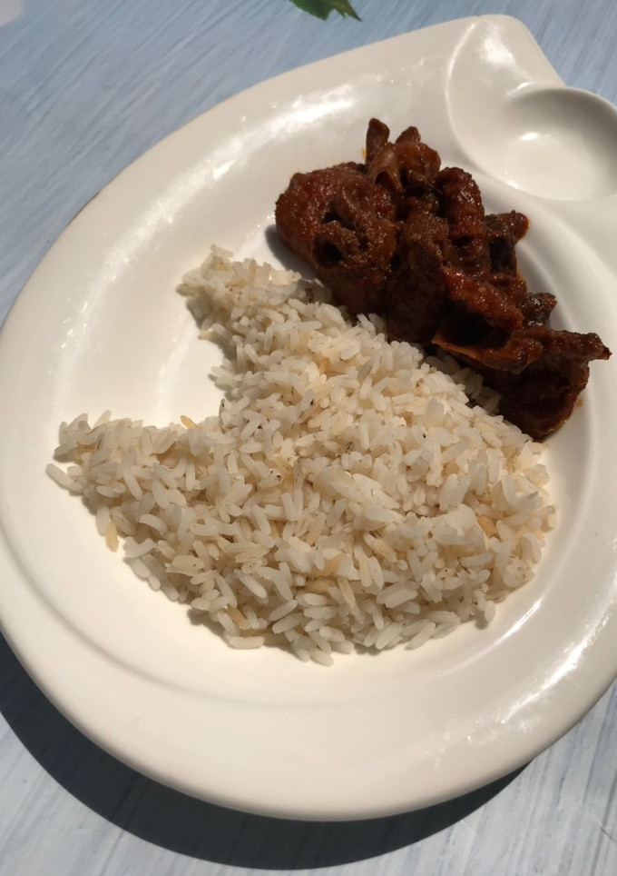 A picture of Rice with sauce.