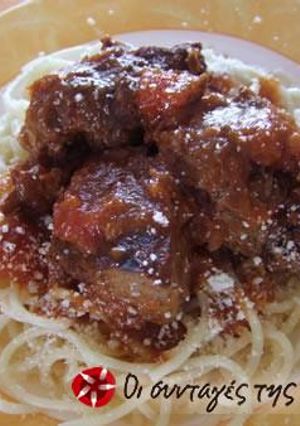 A picture of Veal with tomato sauce.