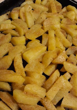 A picture of Roasted potatoes with bread crumb crust.