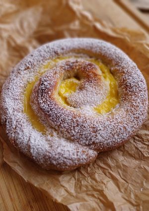 A picture of Lemon and Anise Ensaimada with Pastry Cream.