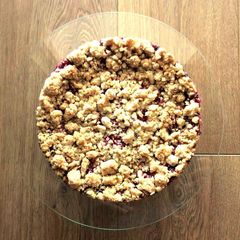 A picture of Cheesecake with seasonal fruit.