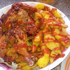 A picture of Rosted chicken and chips.