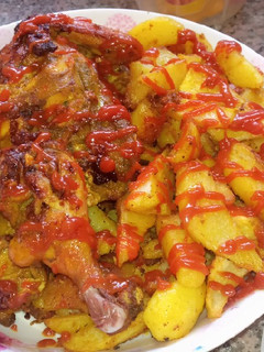 A picture of Rosted chicken and chips.