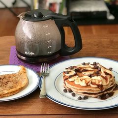 A picture of Chocolate Banana Pancakes And Hash browns.