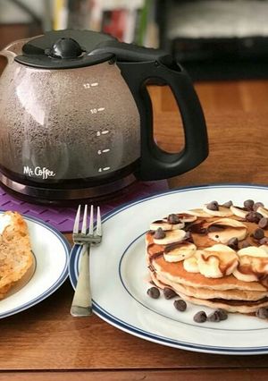 A picture of Chocolate Banana Pancakes And Hash browns.