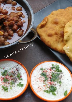 A picture of Delhi Style PaneerBhature /Amritsari Chole /Chutney wale pyaaz aur Dahi #Thetravelexpress.