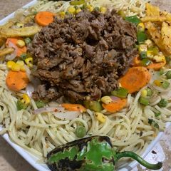 A picture of Herb spaghetti with Behari beef - western and desi fusion.