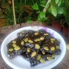 A picture of Pumpkin, black sesame seeds, jaggery chikki.