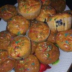 A picture of Blueberry cupcakes with vermicelli.
