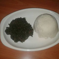 A picture of Managu spinach and ugali.
