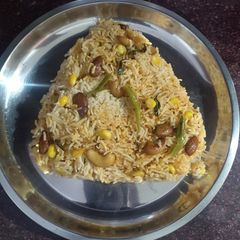 A picture of Corn dry fruit pulao.