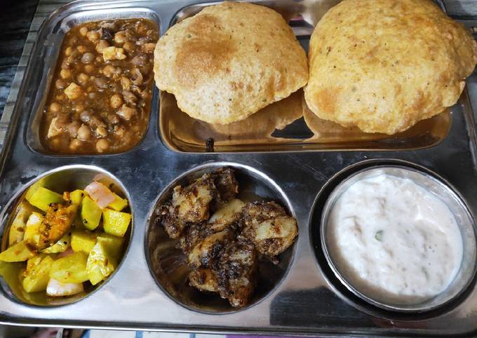 Aloo, Puri, white chane with salad and kheer