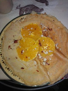 Una foto de Crepes de naranja, avellanas y miel