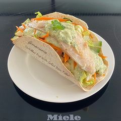 A picture of Tortillas Pup With Salad Basa Fillet.