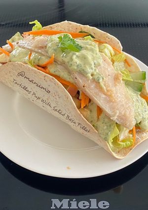 A picture of Tortillas Pup With Salad Basa Fillet.