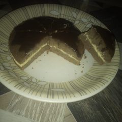 A picture of Chocolate cake with melted chocolate.