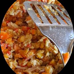 A picture of Scrambled egg with corn.