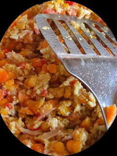 A picture of Scrambled egg with corn.