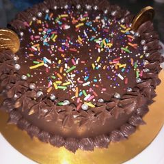 Chocolate buttercream frosting cake A picture of Chocolate buttercream frosting cake.