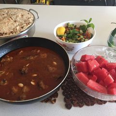 A picture of Chicken qorma with kachumar salad and roti.