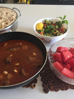 A picture of Chicken qorma with kachumar salad and roti.