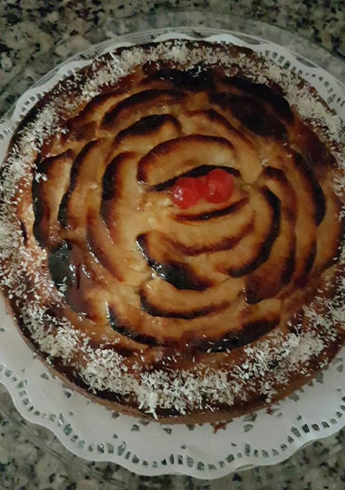 Una foto de Bizcocho de coco, nata y manzana