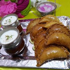 A picture of Thandai and Gujiya.