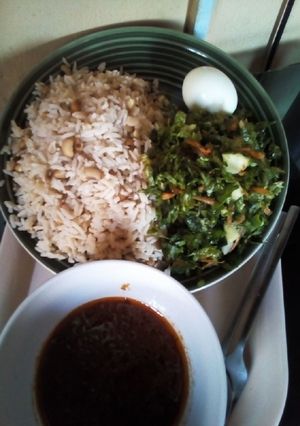 A picture of Rice/Beans Lettuce salad /Crayfish stew & Egg.