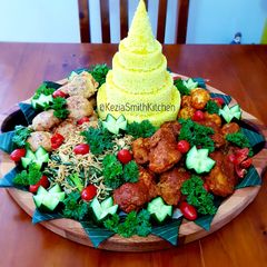 A picture of CHICKEN in RED SAUCE With YELLOW RICE.