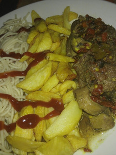 A picture of Pasta with fries and peppered meat sauce.