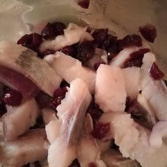 A picture of Herring with cranberries.