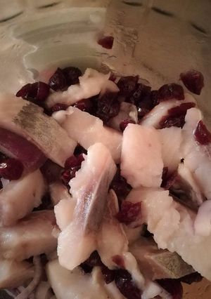 A picture of Herring with cranberries.