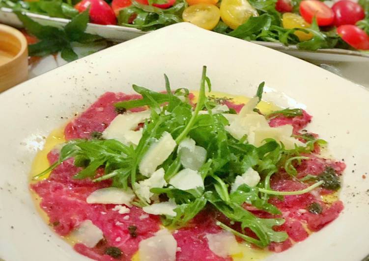 Recipe of Appetizing Beef Carpaccio with Arugula, pesto oil and truffle paste