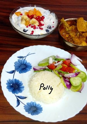 A picture of Rice chicken curry fruit raita.