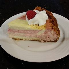 A picture of Striped Fresh Raspberry Cheesecake.