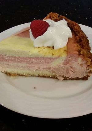 A picture of Striped Fresh Raspberry Cheesecake.