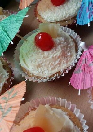 A picture of Vickys Pina Colada Cupcakes, GF DF EF SF NF.