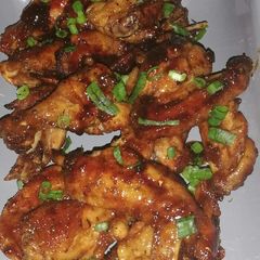A picture of Honey & soy sauce chicken wings.