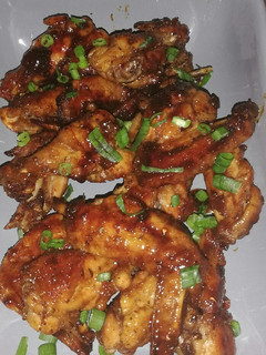 A picture of Honey & soy sauce chicken wings.