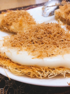 A picture of Knafeh with Milk Pudding and Cinnamon.