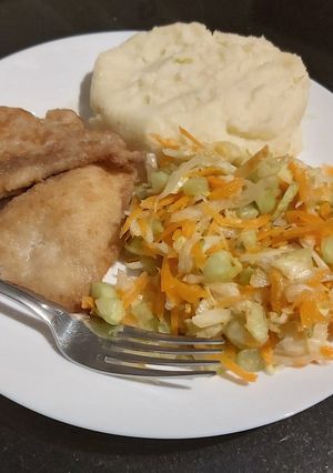 A picture of Mash potatoes, salad n fish fillet.