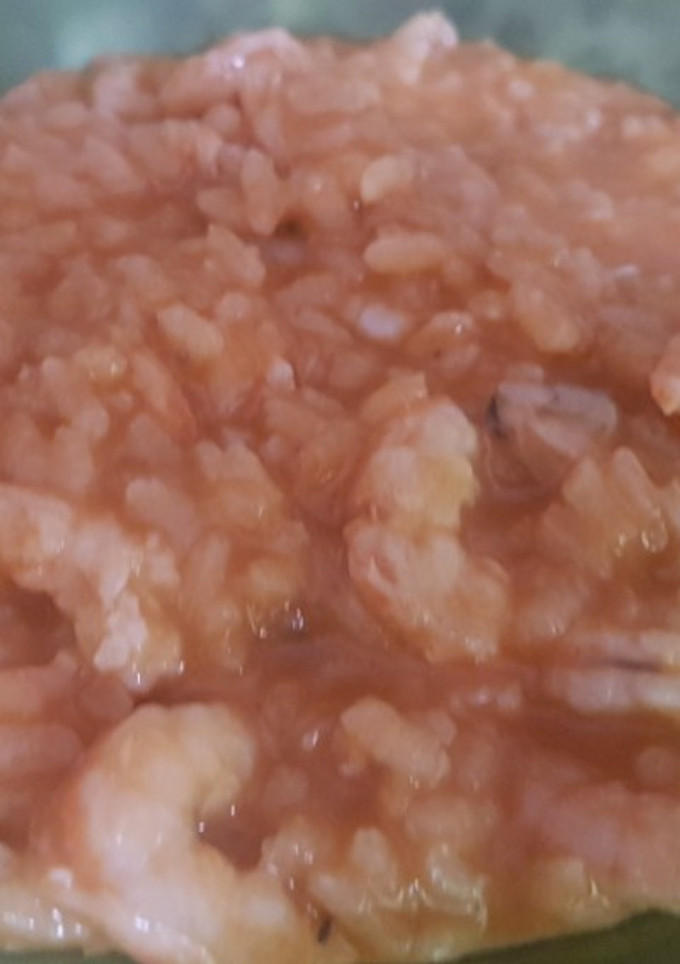 Una foto de Arroz con almejas y gambas