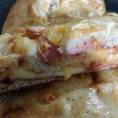 Una foto de Pizza arrollada
