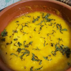 A picture of Mango chutney with daal bhari roti and mango lassi.