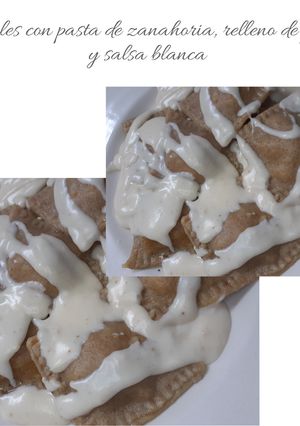 Una foto de Ravioles caseros con pasta de zanahorias y relleno de pollo